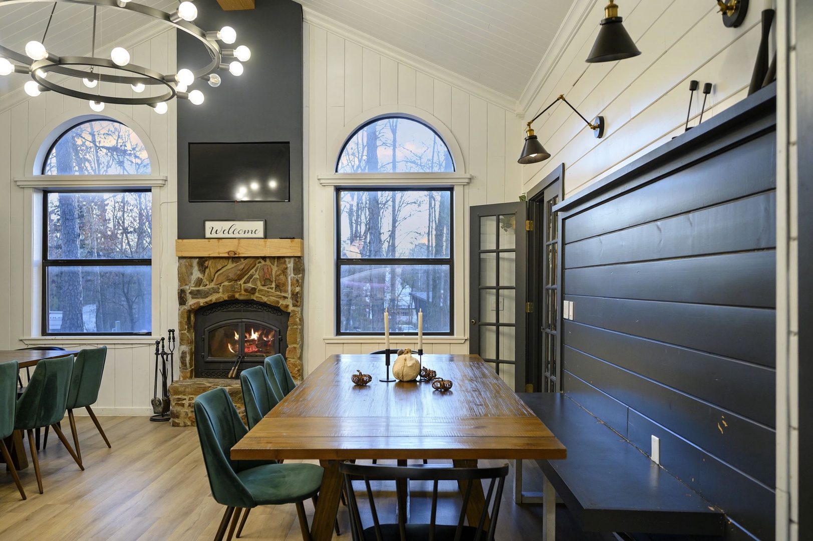 Gather around this stunning dining table where crackling fireplace warmth meets modern elegance, creating perfect moments for your memorable meals together.