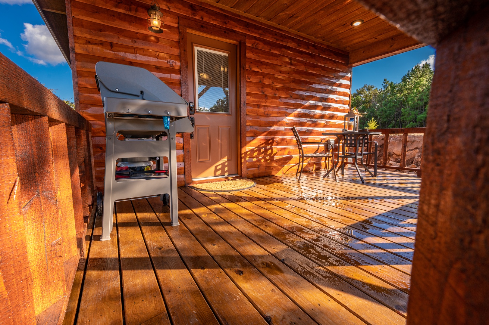 Fire up the grill on your private deck and savor dinner under the evening sky, surrounded by warm wood and forest views.