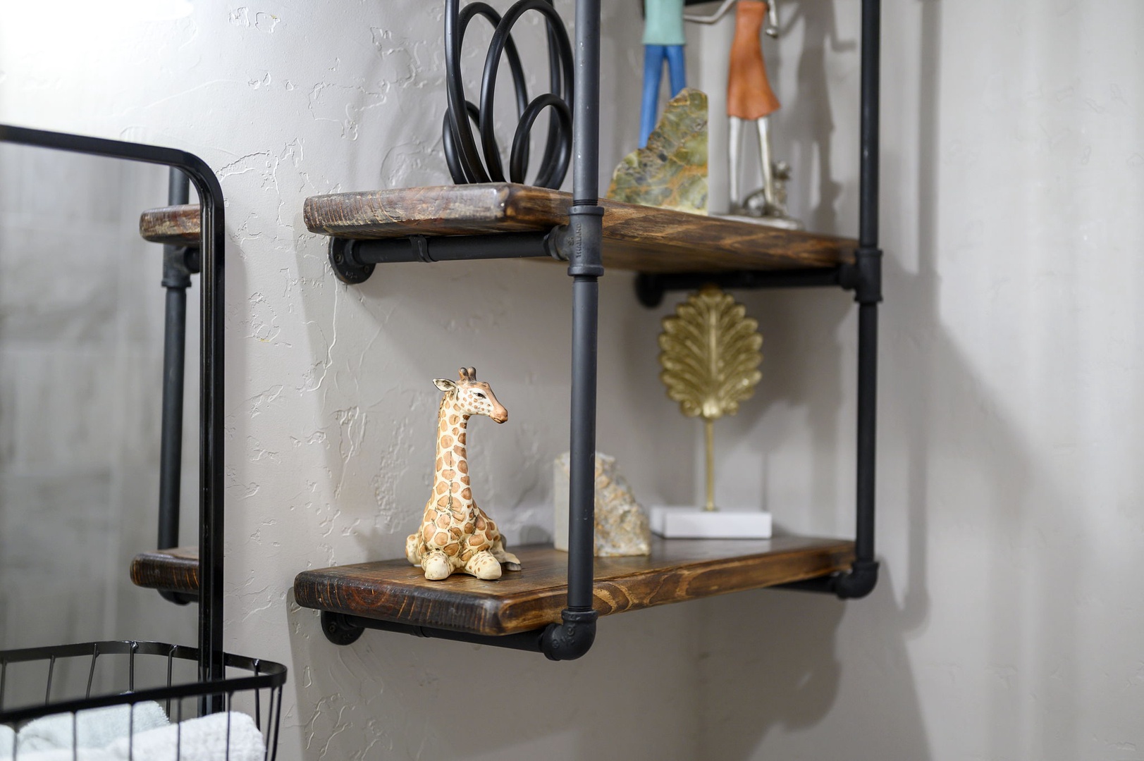 Rustic wooden shelves showcase thoughtful decor touches, adding personality and warmth to your space with charming details.
