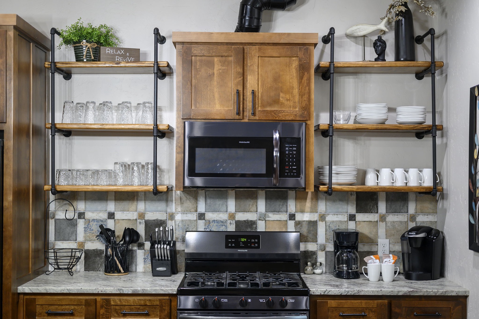 Step into your fully equipped kitchen where rustic wood meets industrial charm—open shelving displays your dishes, while modern appliances make whipping up breakfast a breeze.