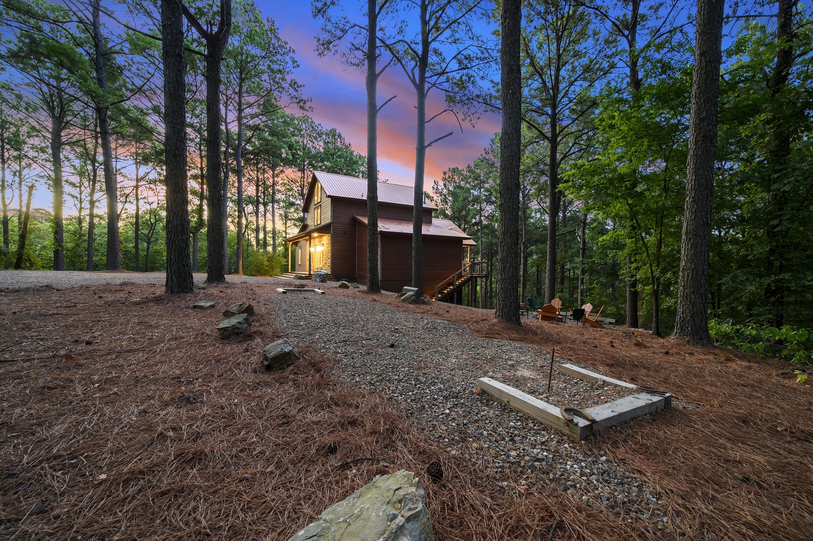 A peaceful woodland cabin nestled among towering pines, illuminated by warm light as twilight colors the sky.