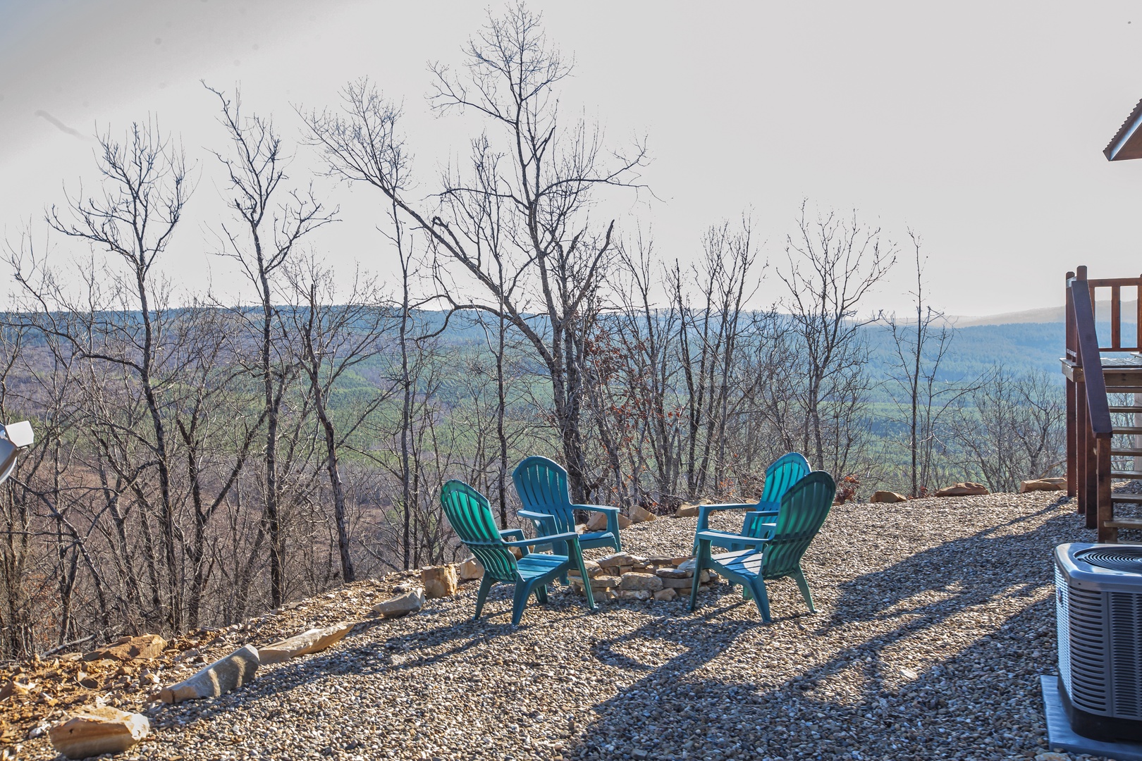 Relax in comfortable chairs while taking in sweeping mountain views from your private outdoor space.