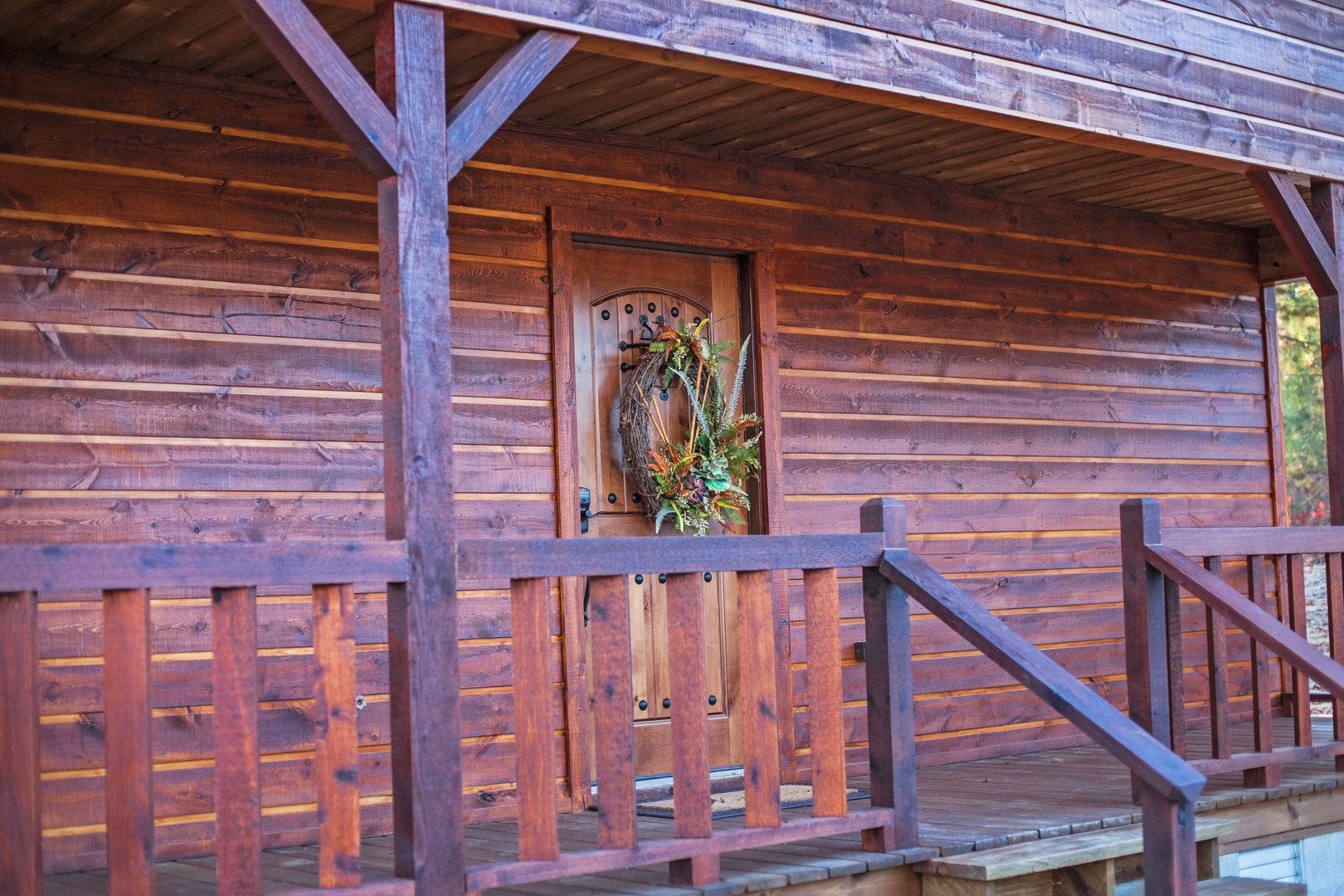 A rustic wooden entrance welcomes you with handcrafted charm and natural beauty.