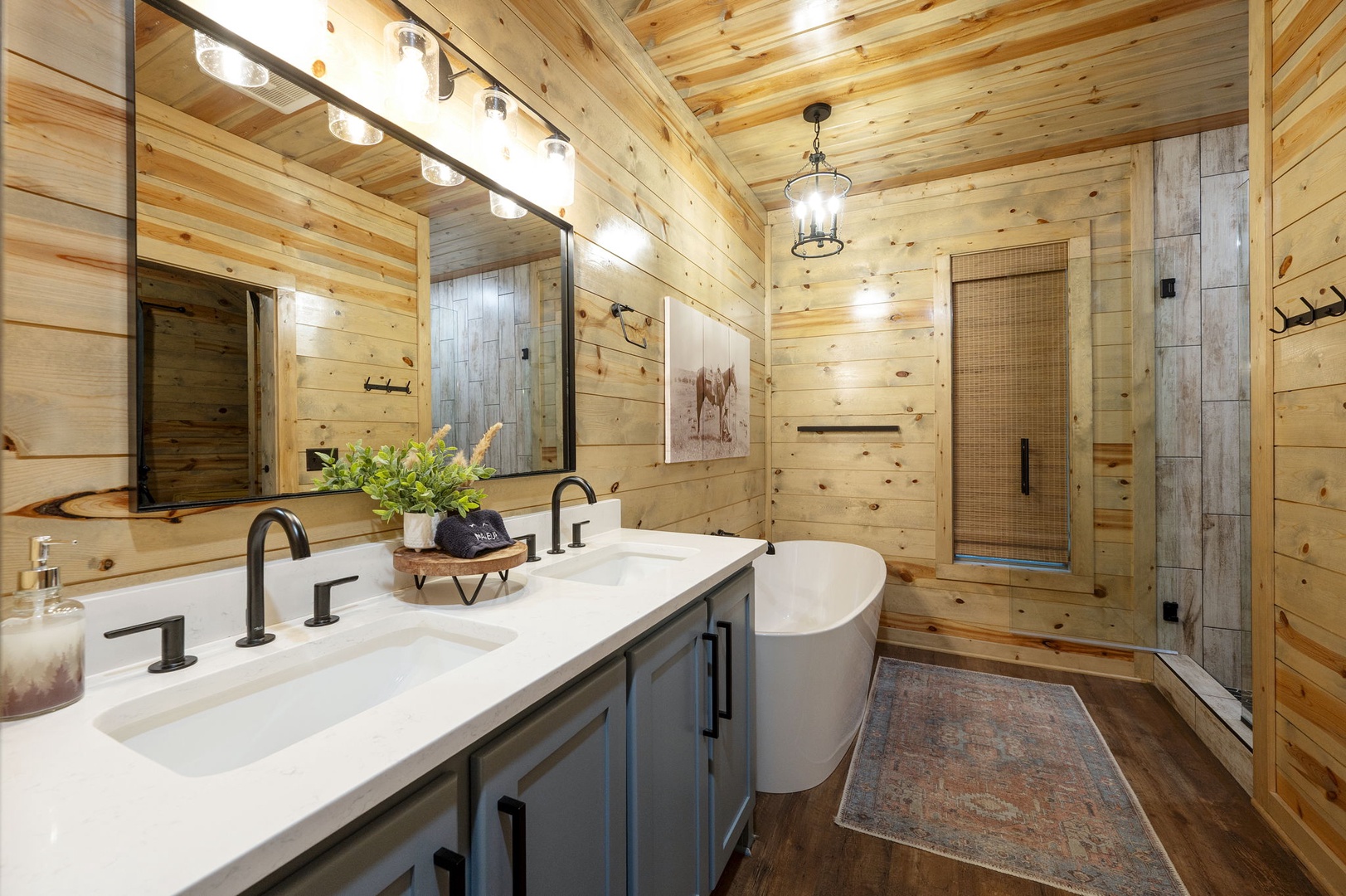 Unwind in your spa-like retreat with warm wood walls, a luxurious soaking tub, and a spacious walk-in shower, all bathed in soft light.