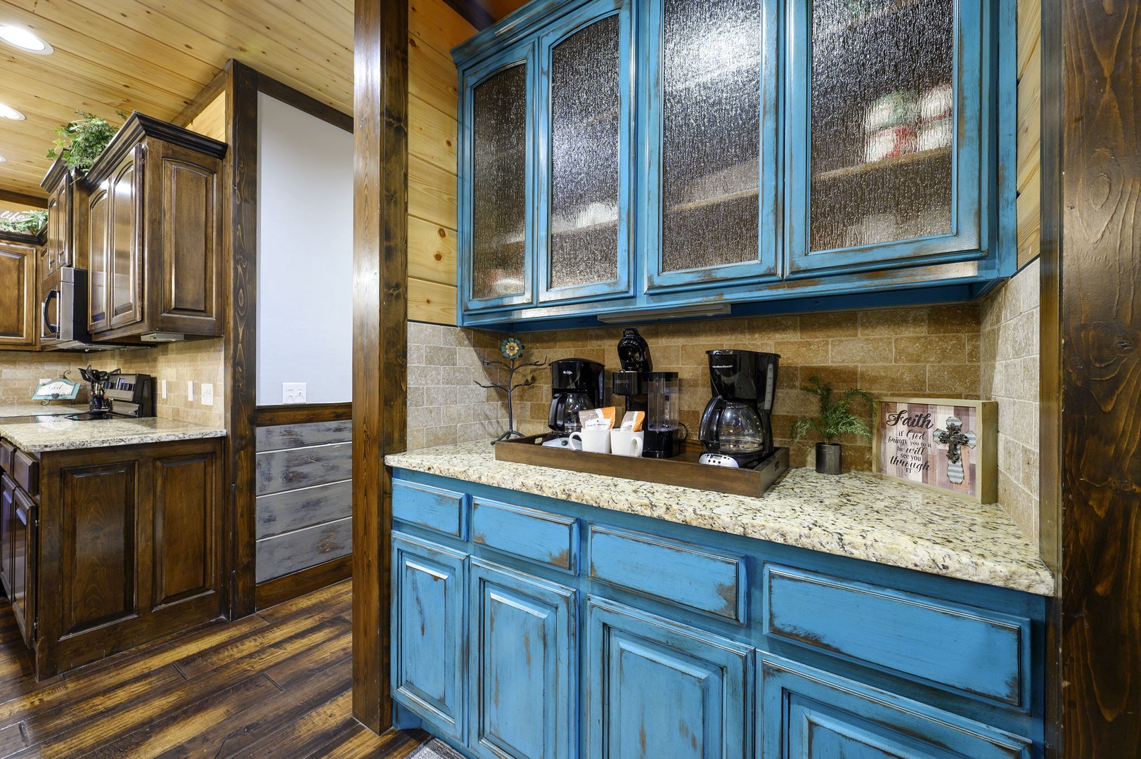 Your fully equipped coffee bar awaits, with multiple brewing options and charming rustic-meets-coastal cabinetry that blends style with function for your morning routine.