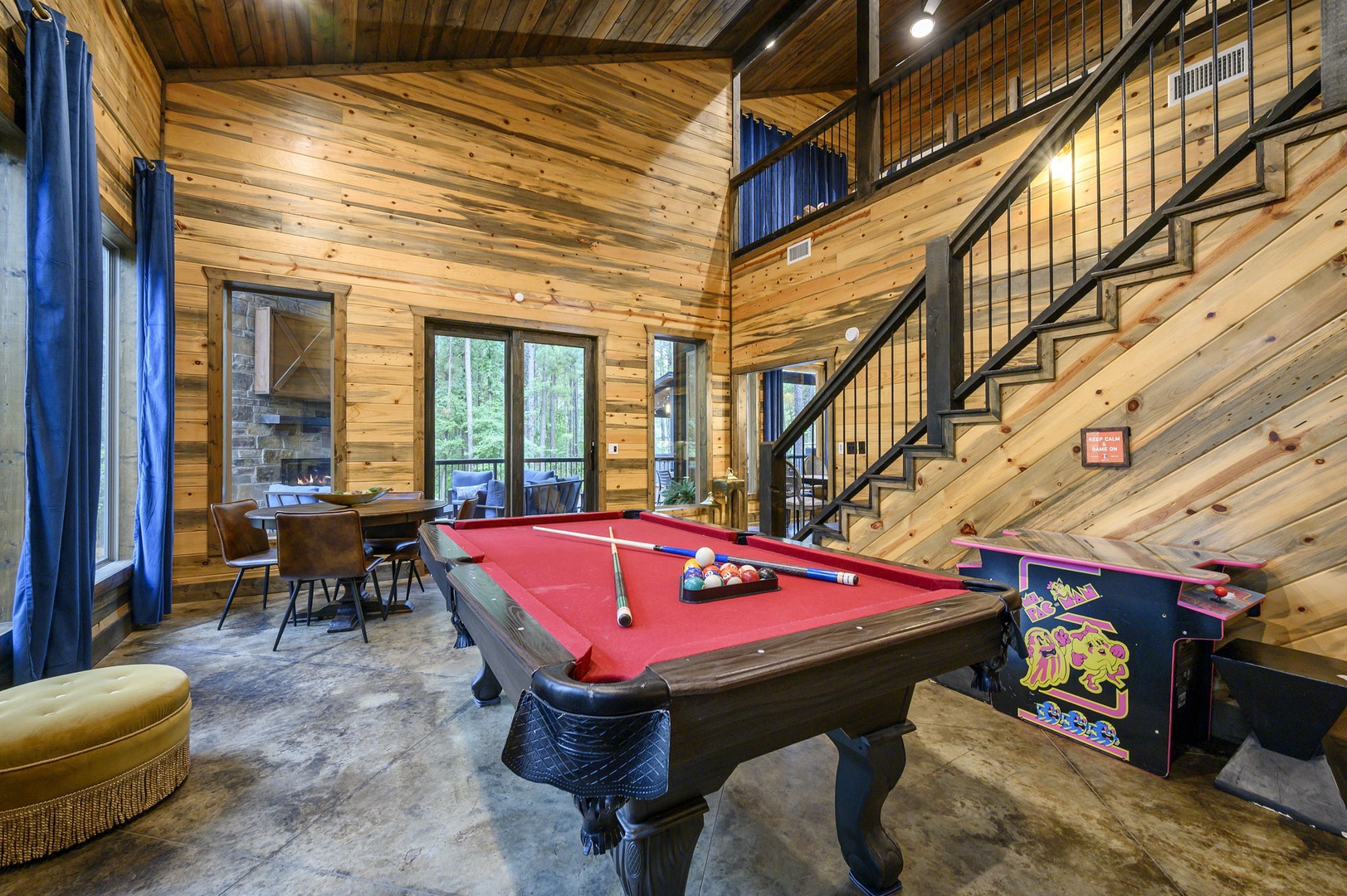 Challenge friends to a game on the full-size billiard table beneath vaulted ceilings, then step onto the private deck to enjoy the surrounding forest.