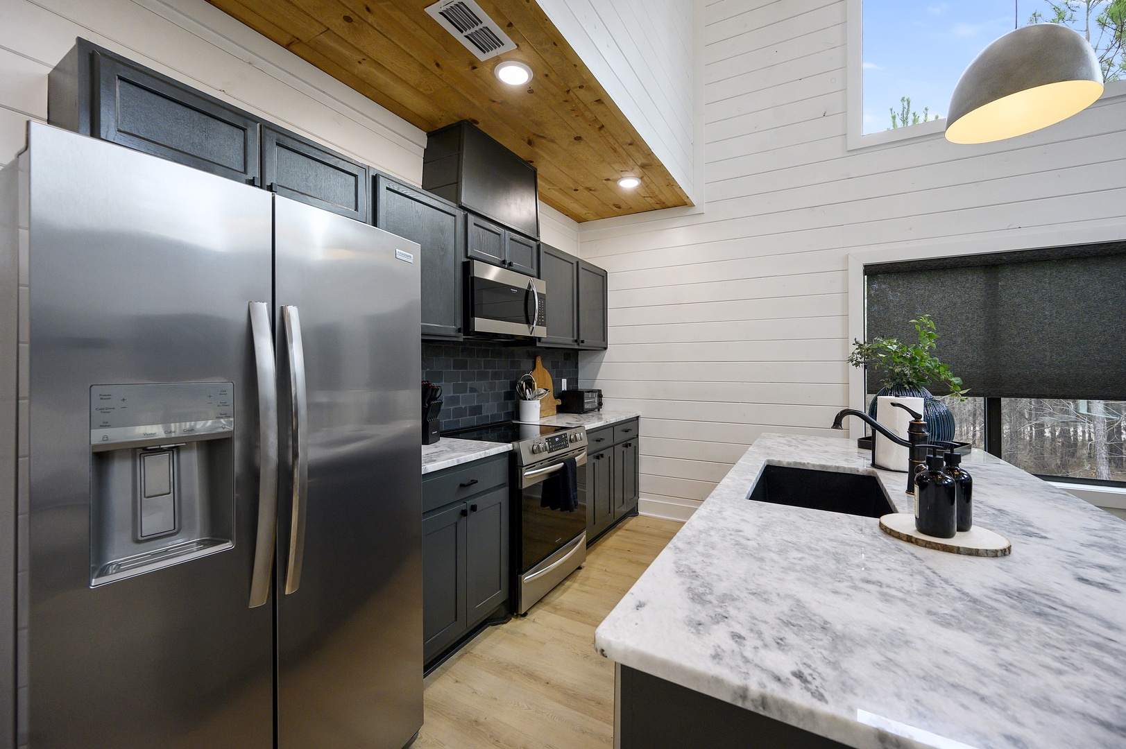 Your gourmet kitchen features modern appliances and marble countertops, perfect for creating memorable meals during your stay.