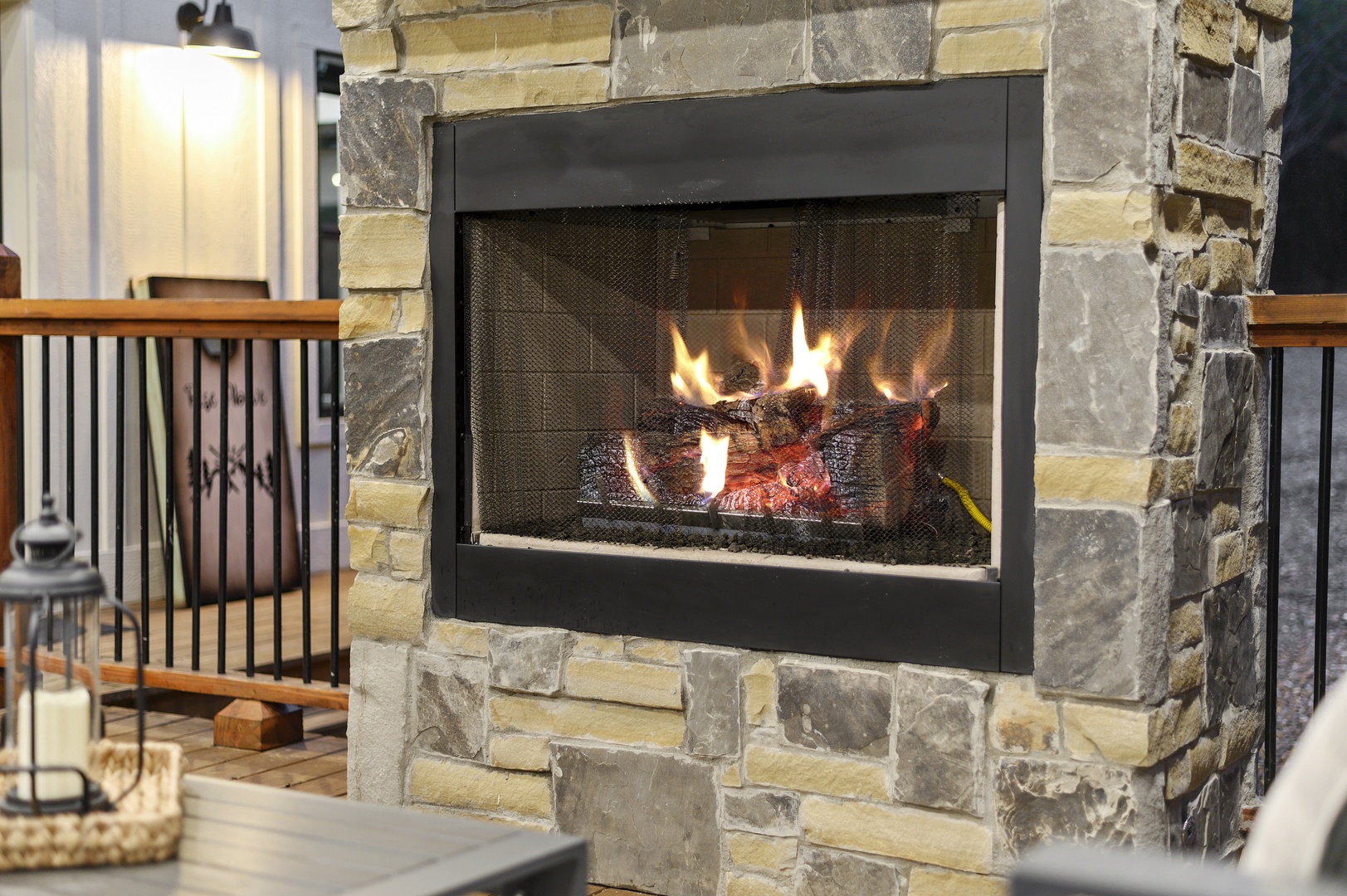 Gather around your stunning stone fireplace where flickering flames create the perfect ambiance for cozy evenings with loved ones.