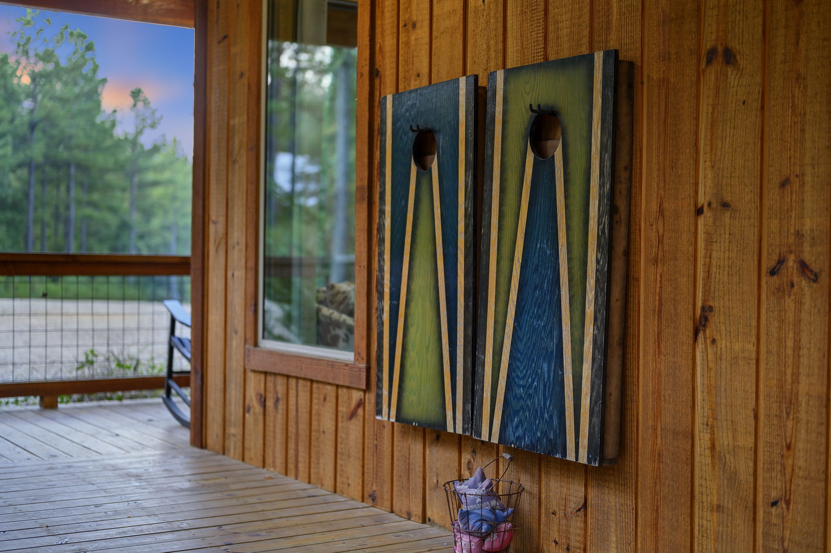 Step onto your private deck where rustic paddle décor and peaceful wooded surroundings create a welcoming retreat. Take a moment to soak in the natural beauty just outside your door.