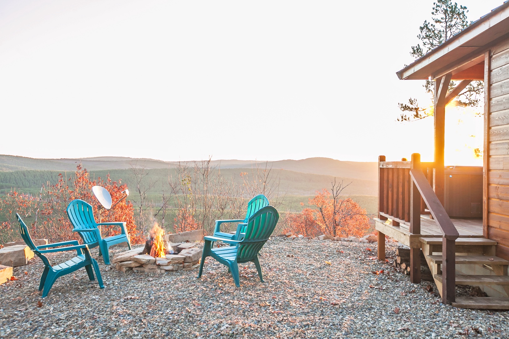 Gather around the crackling fire pit as golden sunset light bathes the mountain views, creating perfect moments for evening relaxation.