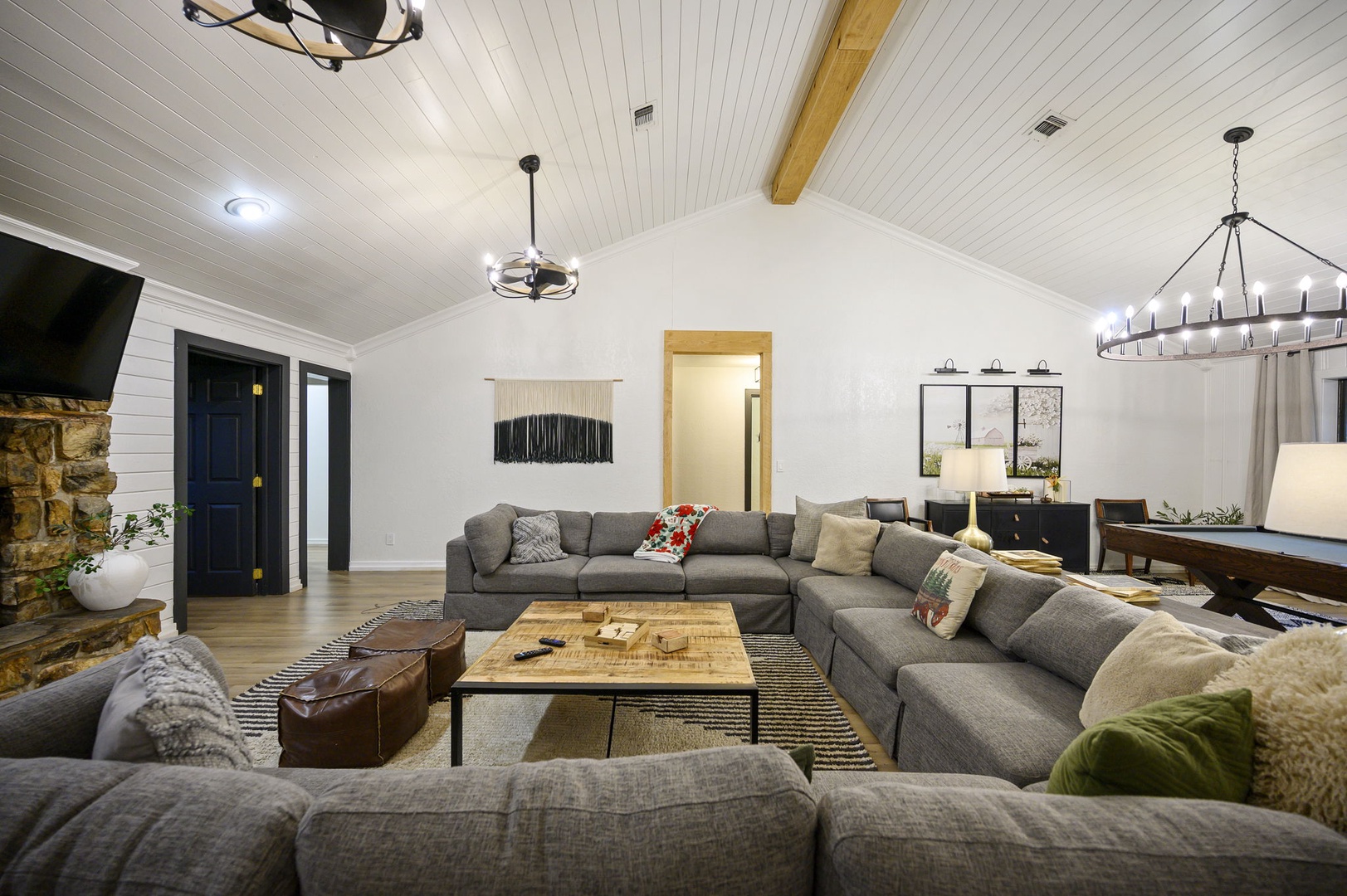 Sink into this oversized sectional where your whole group can gather for movie nights beneath rustic beamed ceilings and modern farmhouse charm.