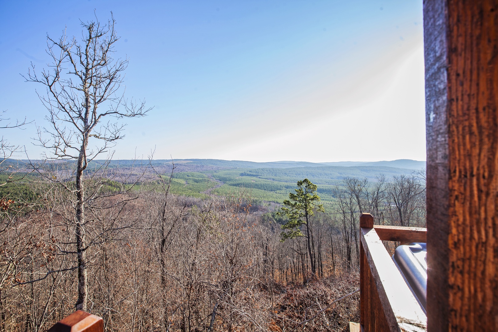 Unwind on your private balcony with sweeping mountain views stretching endlessly across rolling forested hills.