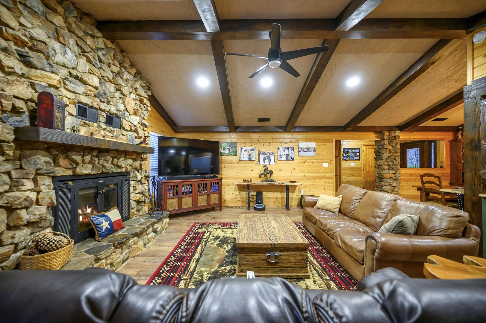 Relax in your rustic living room with exposed stone walls, and leather seating for cozy evenings. Please note that the fireplace is not available for guest use.