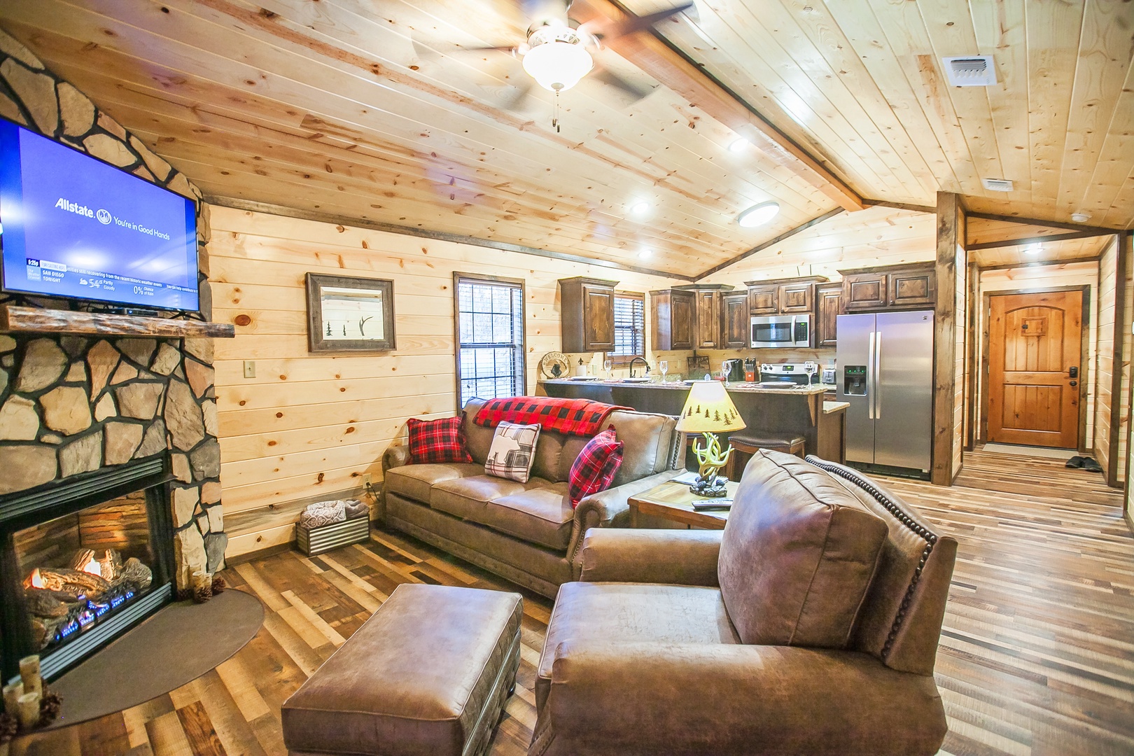 Cozy up by your private fireplace in this rustic living space, where leather seating and warm wood create the perfect mountain retreat.