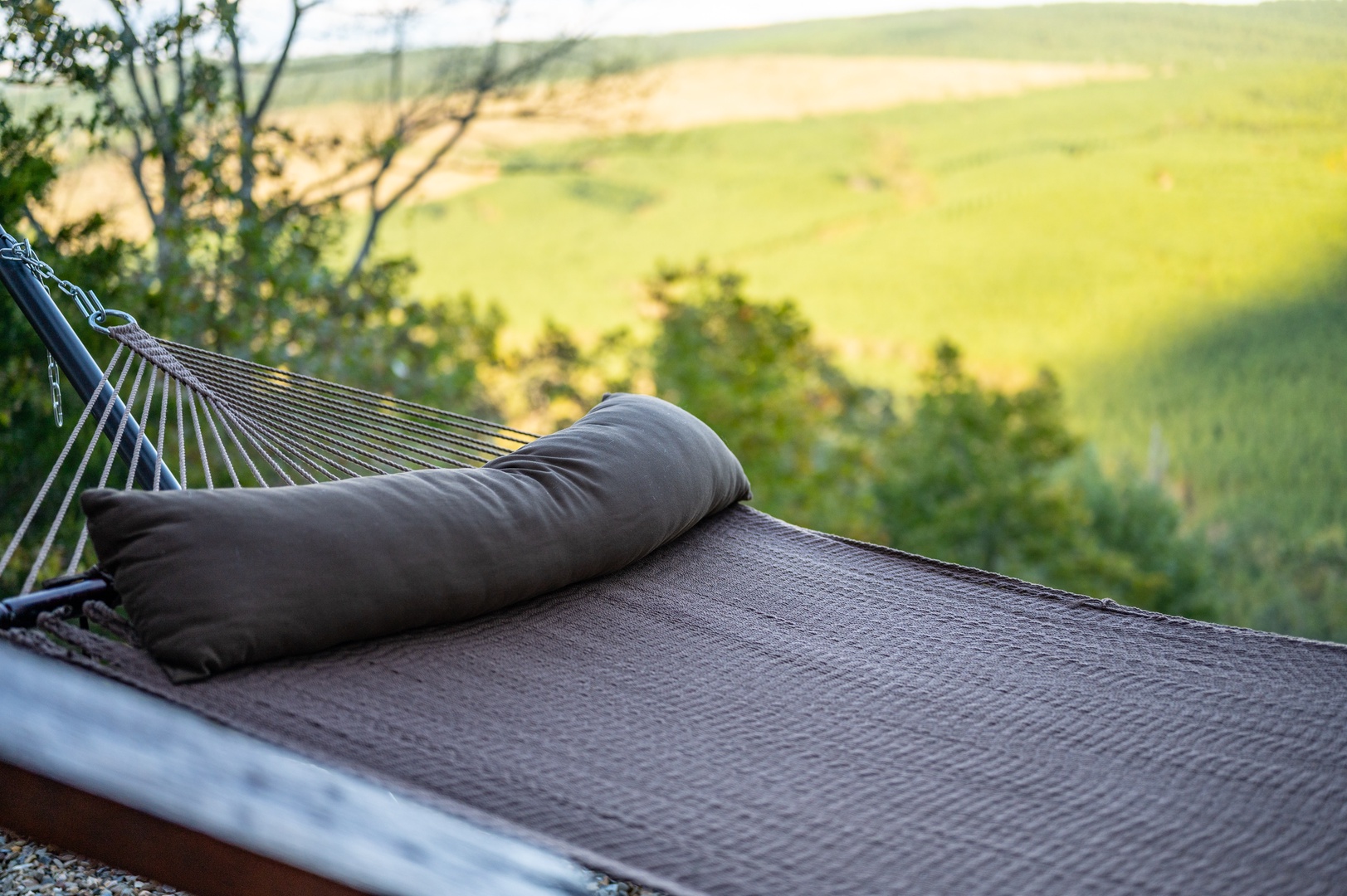 Drift into pure relaxation on your private hammock, where rolling countryside views and gentle breezes create the perfect afternoon escape.