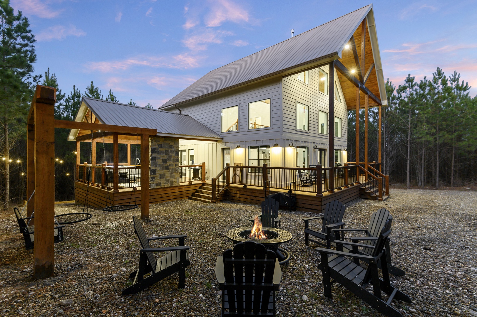Modern cabin nestled in peaceful forest setting with spacious deck and fire pit for memorable evenings under the stars.