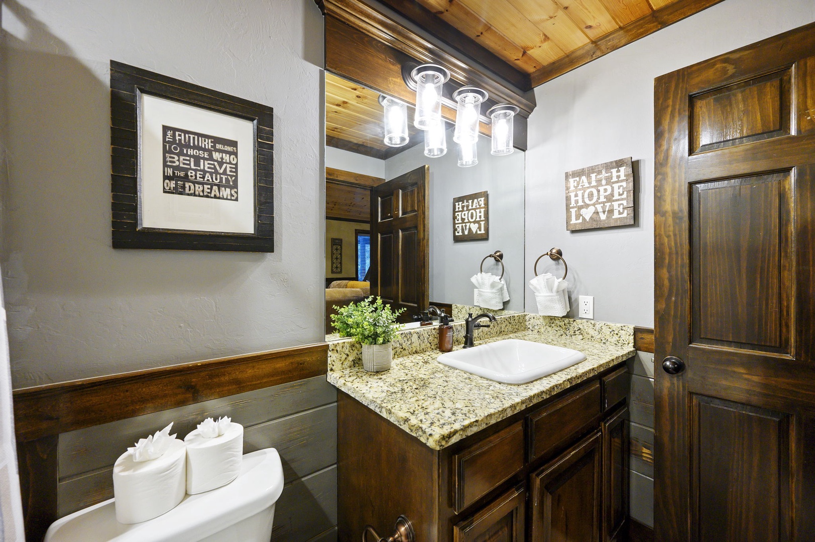 Freshen up in your beautifully appointed bathroom, where rustic charm meets modern comfort with granite countertops and thoughtful touches that make you feel right at home.