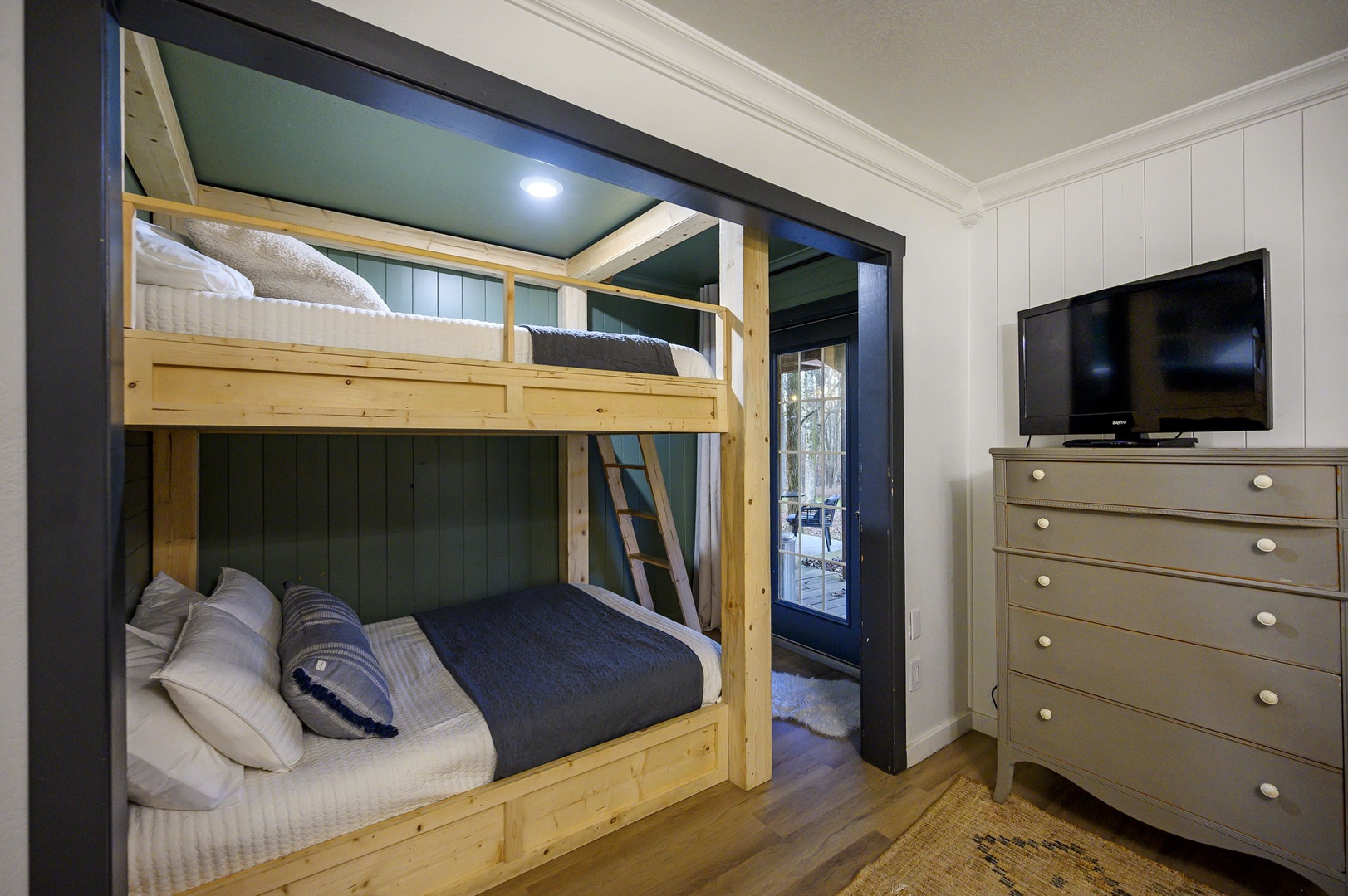 Your cozy bunk bed nook offers comfortable sleeping with thoughtful touches like soft linens and built-in storage.