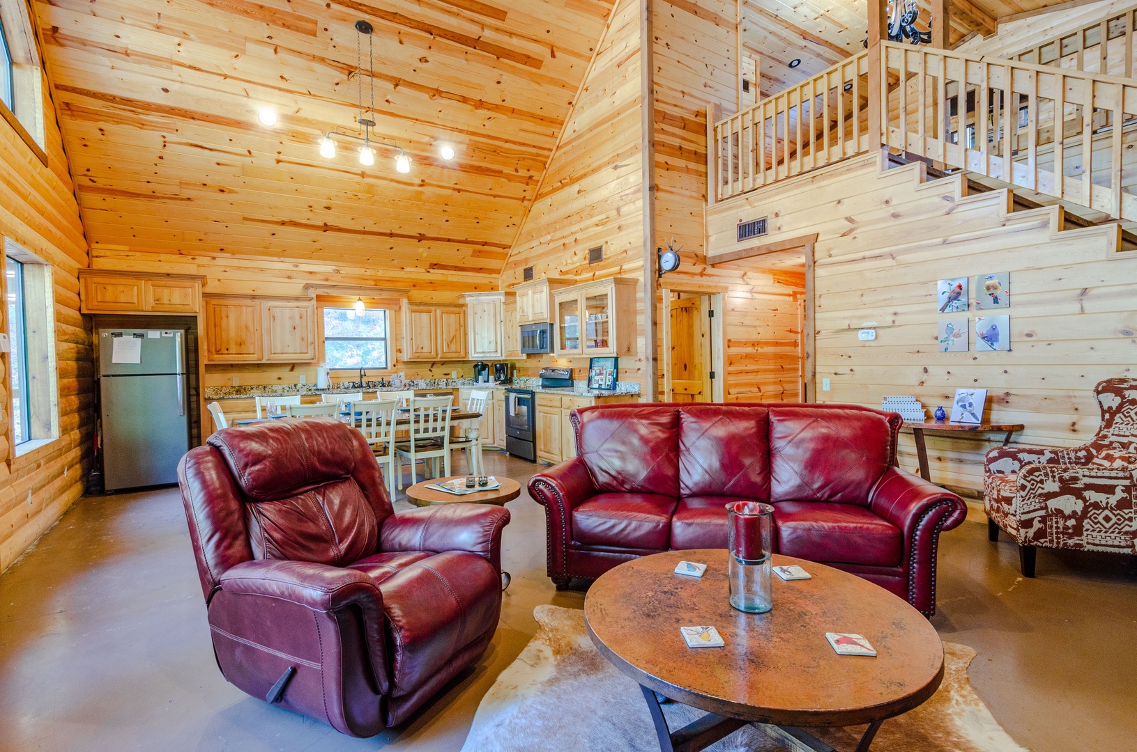 Sink into plush leather seating under soaring vaulted ceilings where warm wood tones and an open loft create your cozy mountain escape.