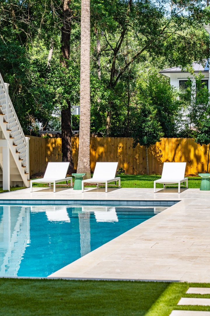 Stretch out poolside under leafy trees, soaking in the sunshine and quiet—your private outdoor retreat awaits.