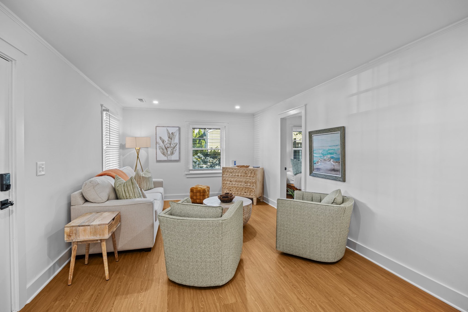 Sink into plush seating and natural light in your peaceful living room, where thoughtful coastal touches create the perfect retreat.