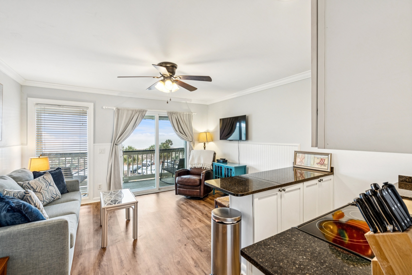 Relax in your bright open-plan space with a fully equipped kitchen and cozy living area leading to your private balcony.