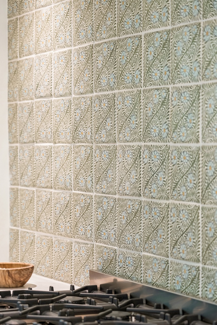 This hand-carved tile backsplash brings artisan texture and soft, organic pattern to your kitchen. You'll love how it catches the light while you cook.