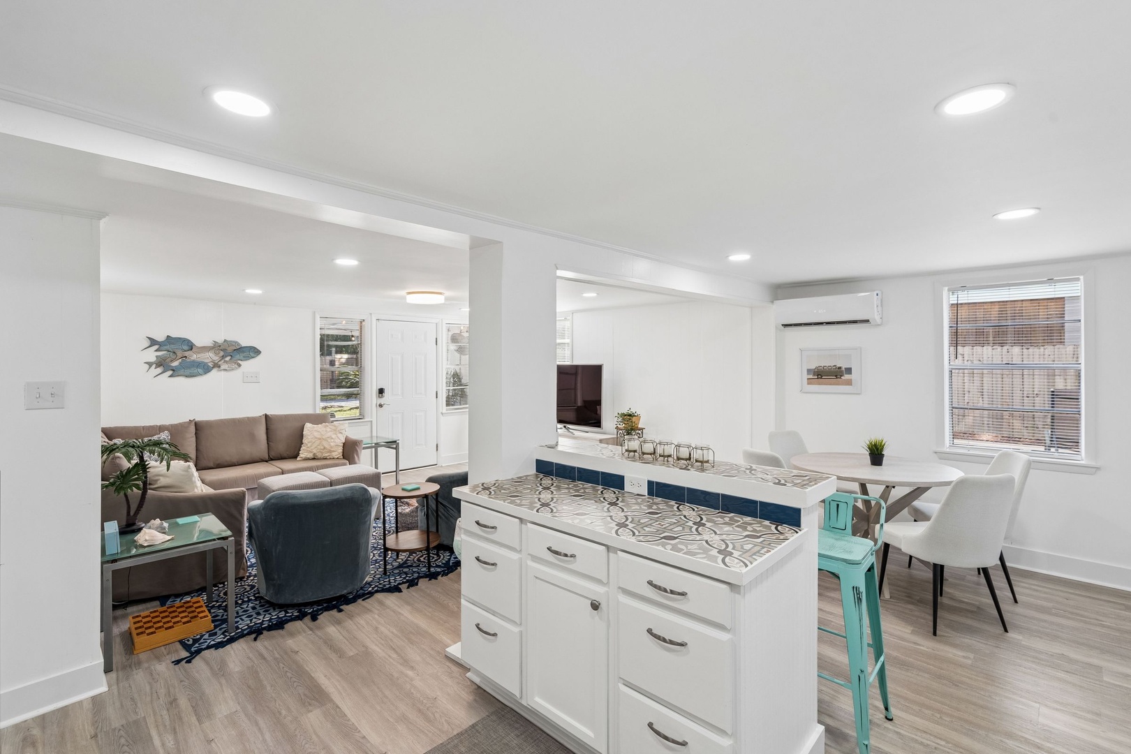 Relax in your bright, open-concept space where the kitchen island becomes your morning coffee spot and evening gathering place.