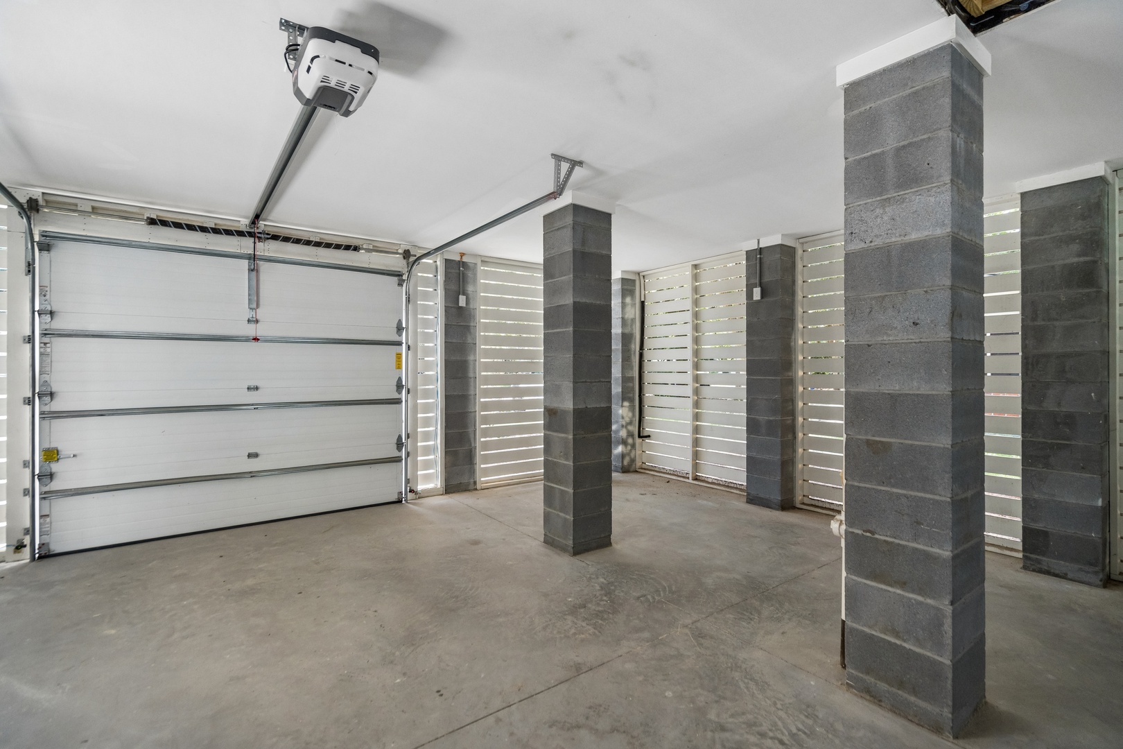 Spacious garage with modern features, perfect for secure parking and extra storage during your stay.