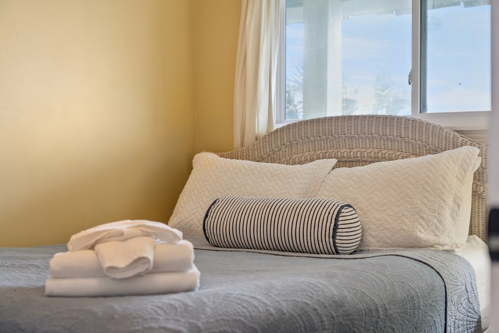 Sink into your cozy wicker bed with soft linens and fresh towels waiting for you in this sunny, peaceful retreat.