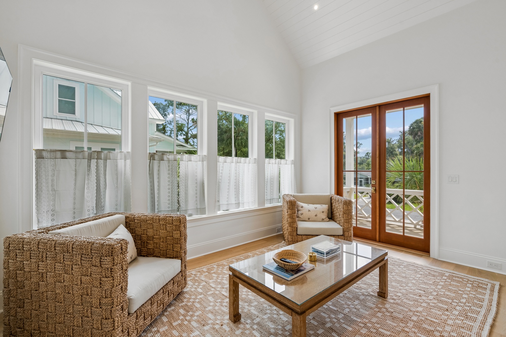 Settle into your cozy seating area flooded with natural light, where soft textures and calming views invite you to unwind with a good book or morning coffee.