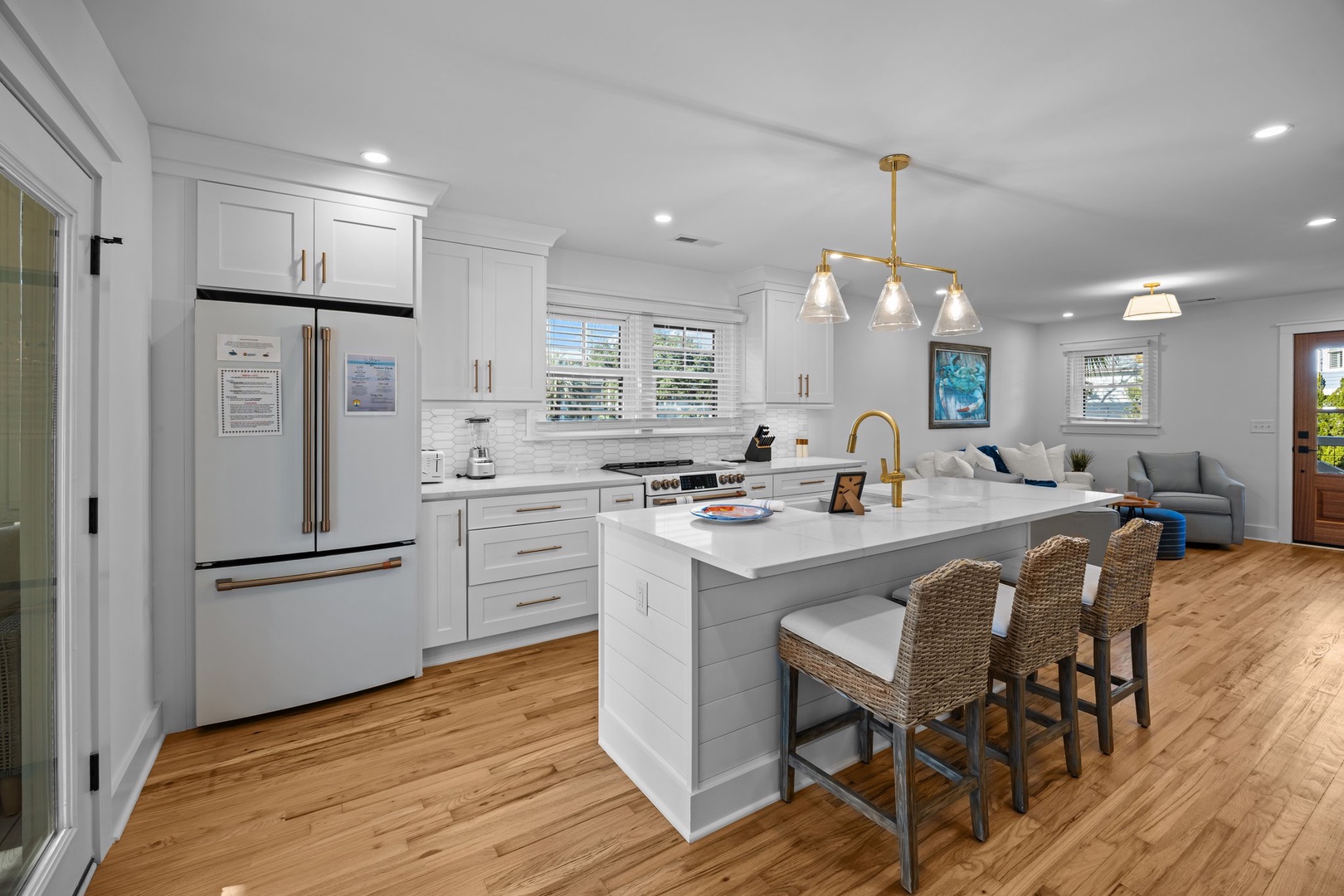 Step into your dream kitchen featuring crisp white cabinets, gleaming quartz countertops, and modern appliances that make cooking feel effortless and inspiring.