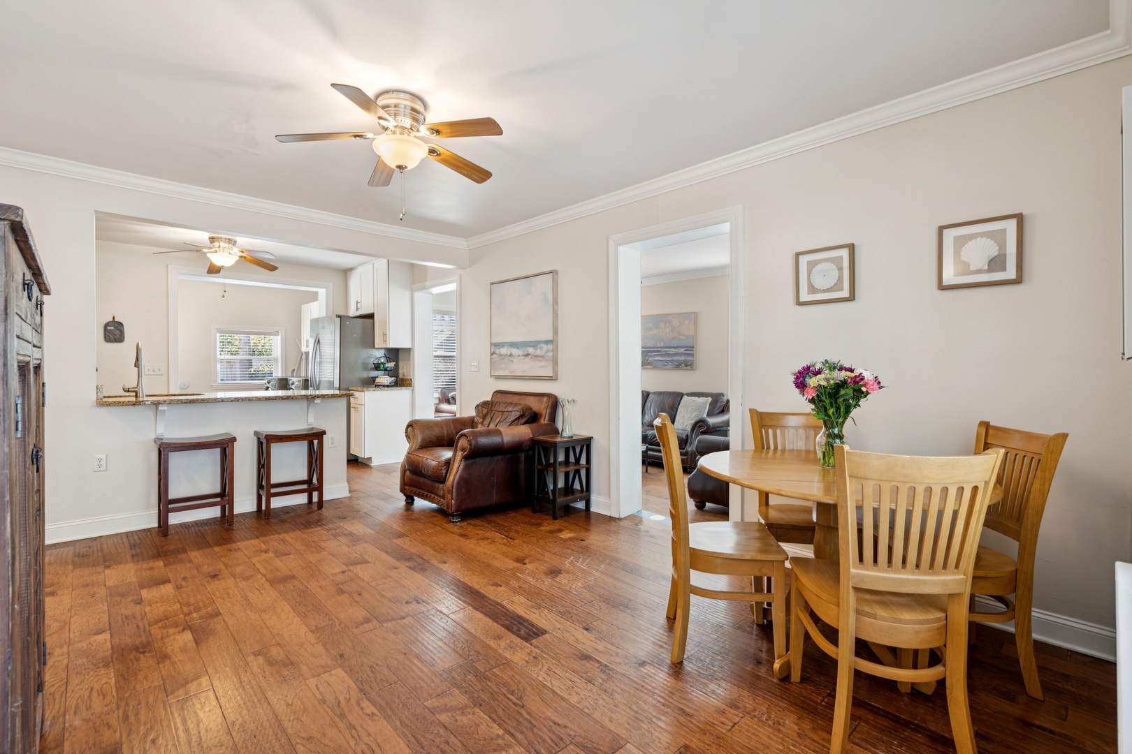 Gather around your dining table while the open kitchen design keeps you connected to family conversations.