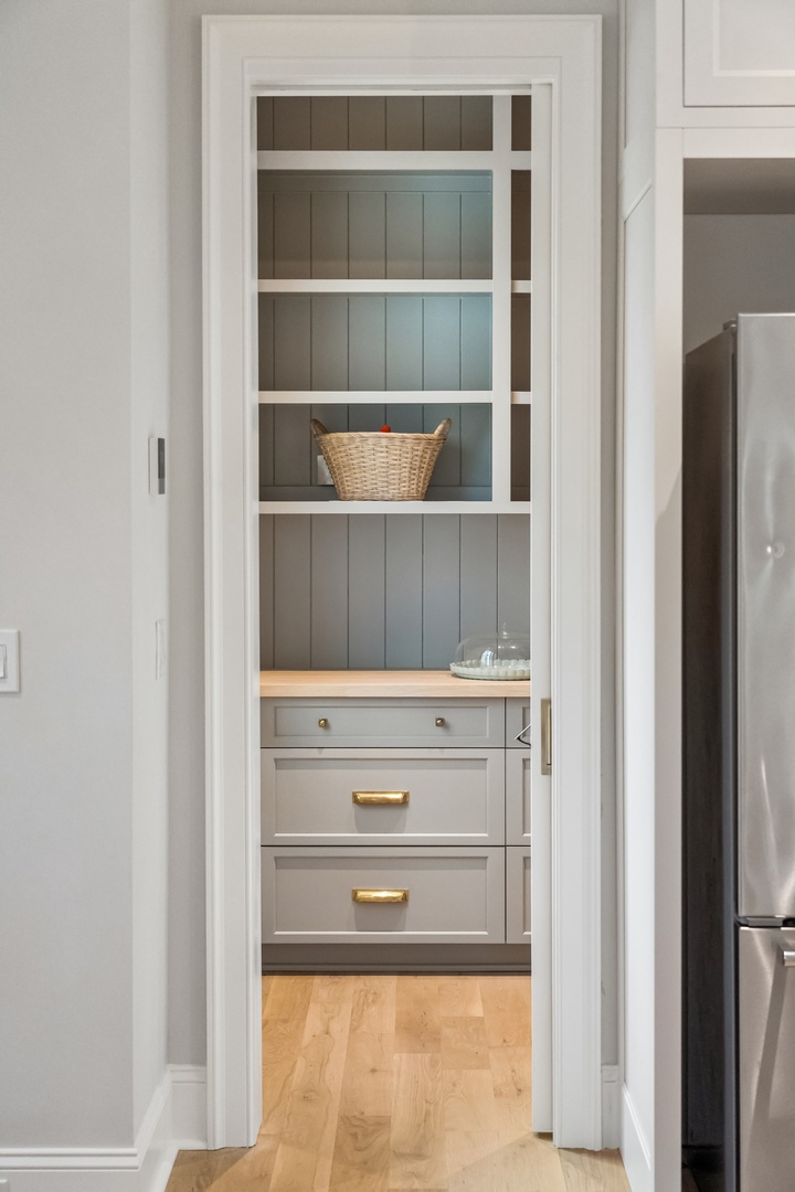 Step into your organized retreat, where custom built-ins and soft coastal tones keep everything beautifully in its place.