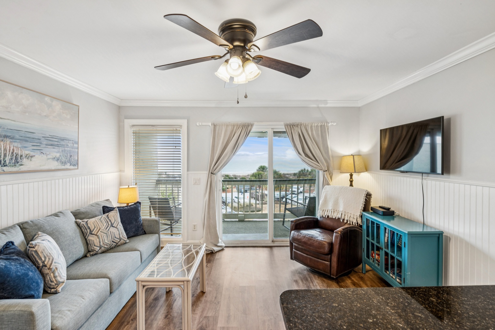 Unwind in your bright, coastal-inspired living room with plush seating and marina views from your private balcony.