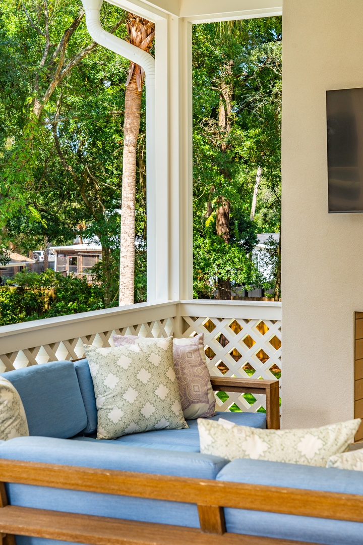 Settle into your private patio seating surrounded by lush tropical greenery—your peaceful spot to unwind with morning coffee or soak in the natural beauty all around you.