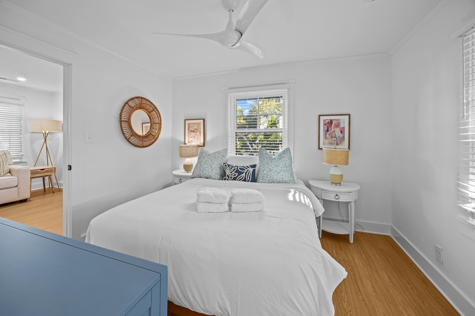 Unwind in your serene bedroom with crisp white linens and coastal touches that create the perfect peaceful retreat.