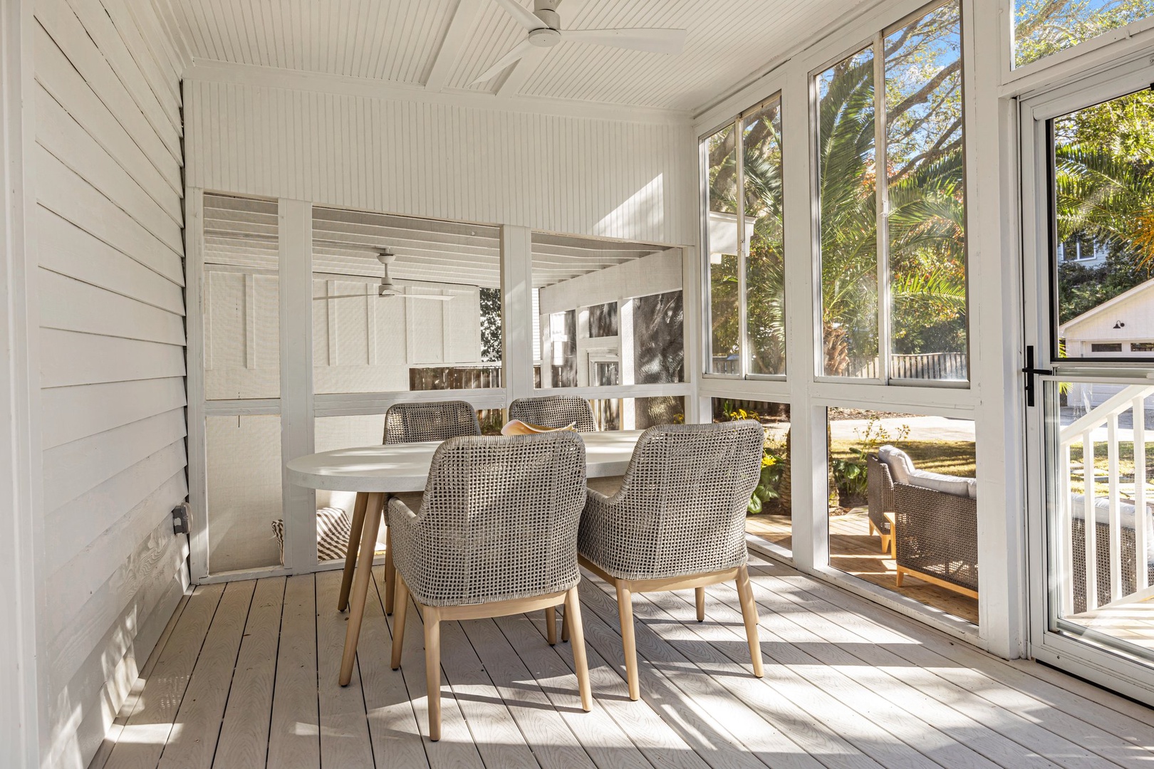 Start your mornings in this bright, airy dining space where natural light streams through expansive windows, creating the perfect spot for leisurely meals.