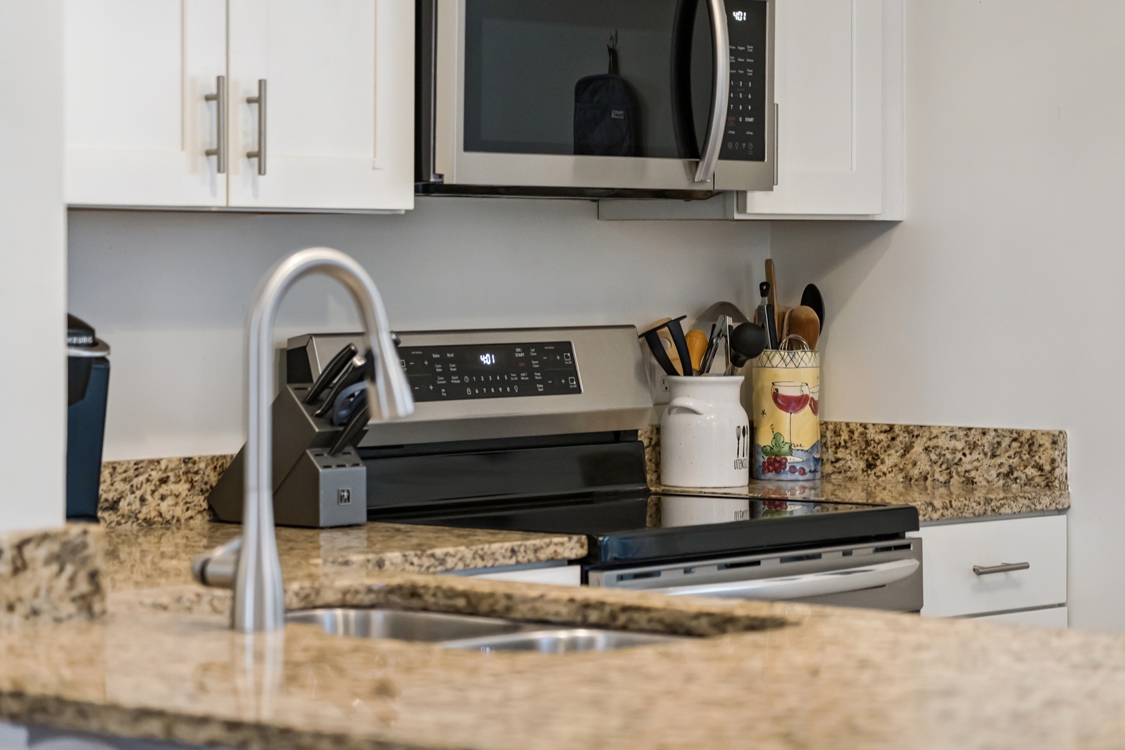 Your fully-equipped kitchen awaits with granite counters, stainless appliances, and everything you need to create delicious meals during your stay.