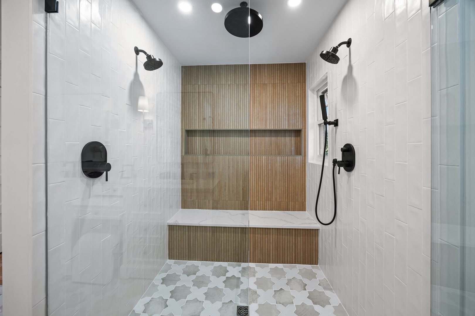 Step into your luxurious dual-head shower sanctuary, where modern black fixtures and spa-like rainfall heads create the perfect retreat for unwinding.