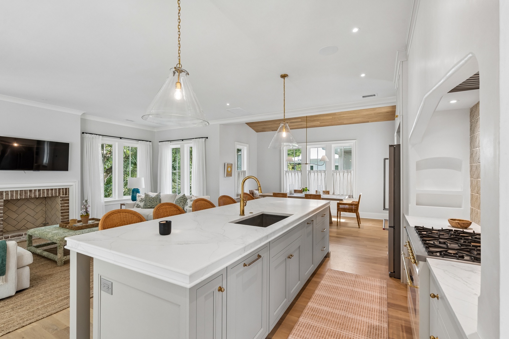 Your gourmet kitchen features a generous island and opens seamlessly to the dining and living areas, perfect for gathering with loved ones while you prepare meals.