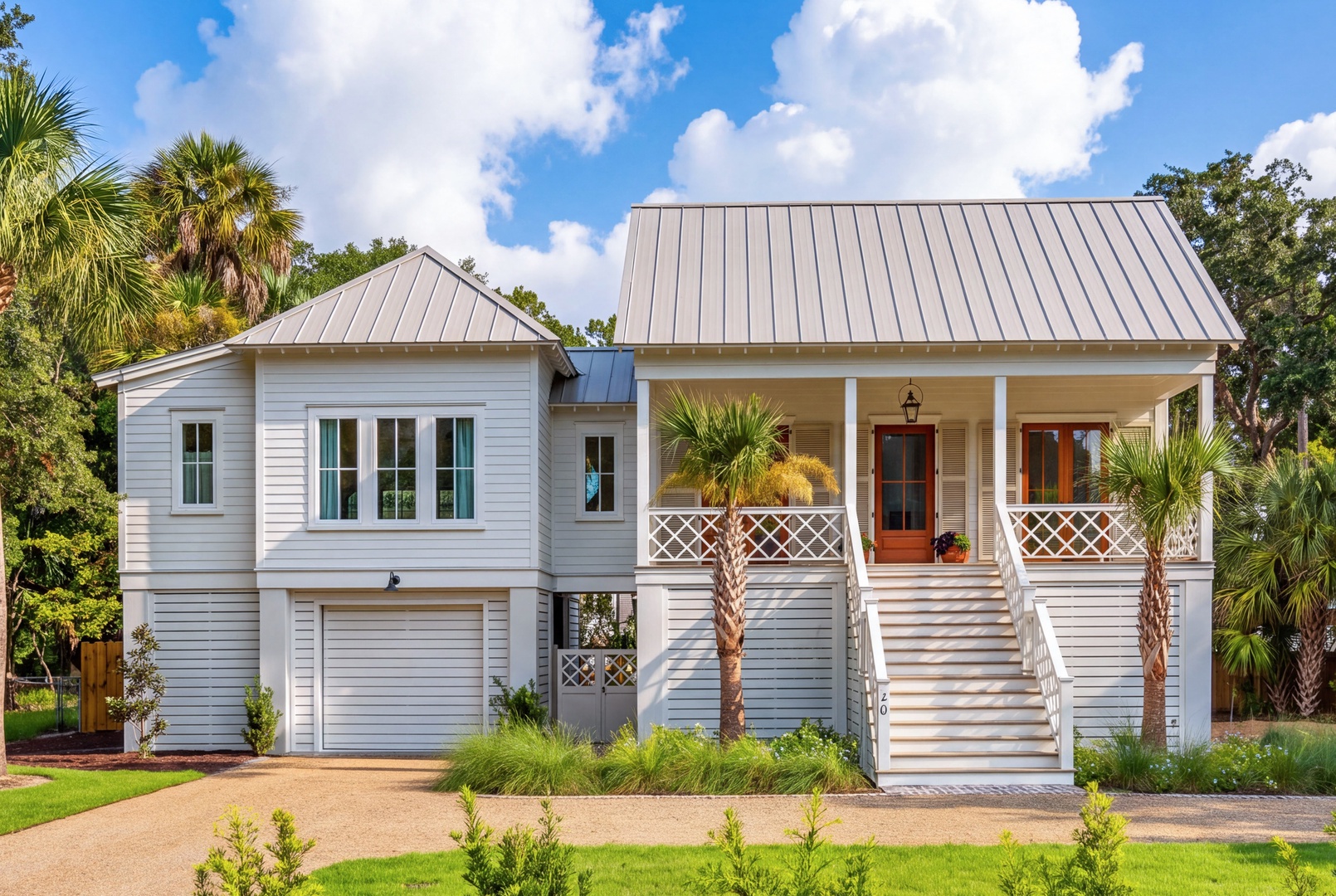 A charming coastal-style vacation home set among swaying palms and lush greenery. The property features a welcoming front porch and blends Southern elegance with tropical surroundings, creating a relaxing retreat in a tranquil neighborhood.