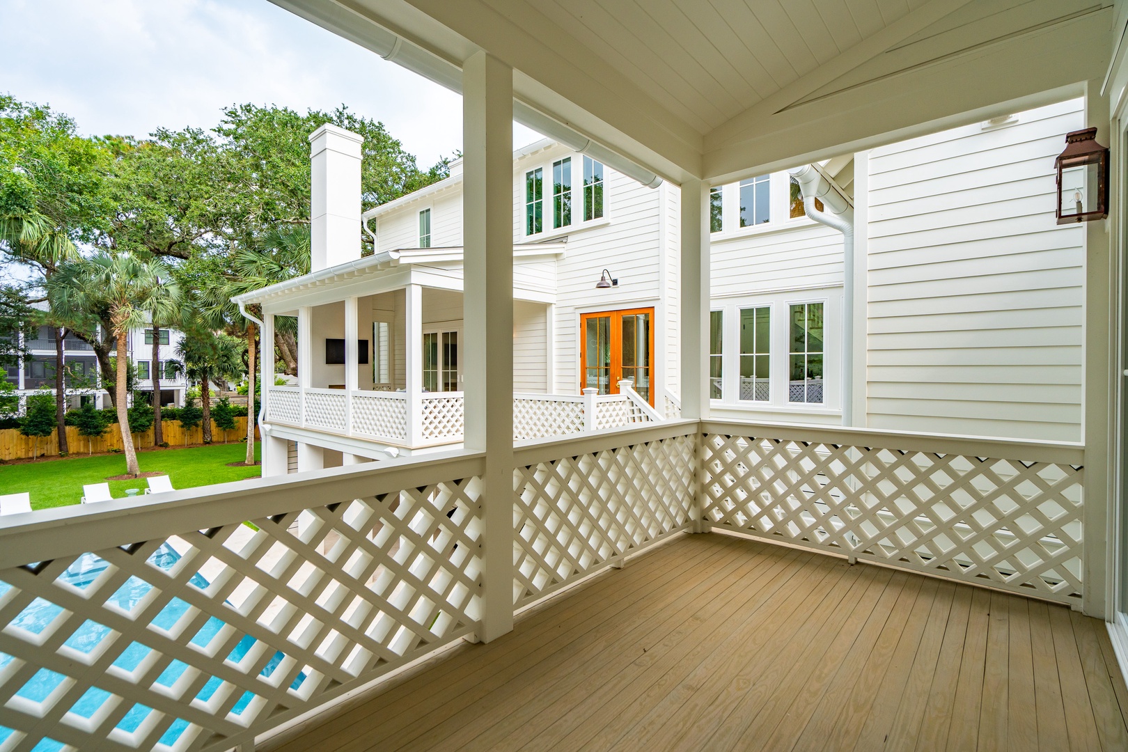 Step out onto your private patio and soak in the lush green garden views—complete with palm trees and a sparkling pool just below. The perfect spot to unwind with your morning coffee or enjoy a quiet evening breeze.