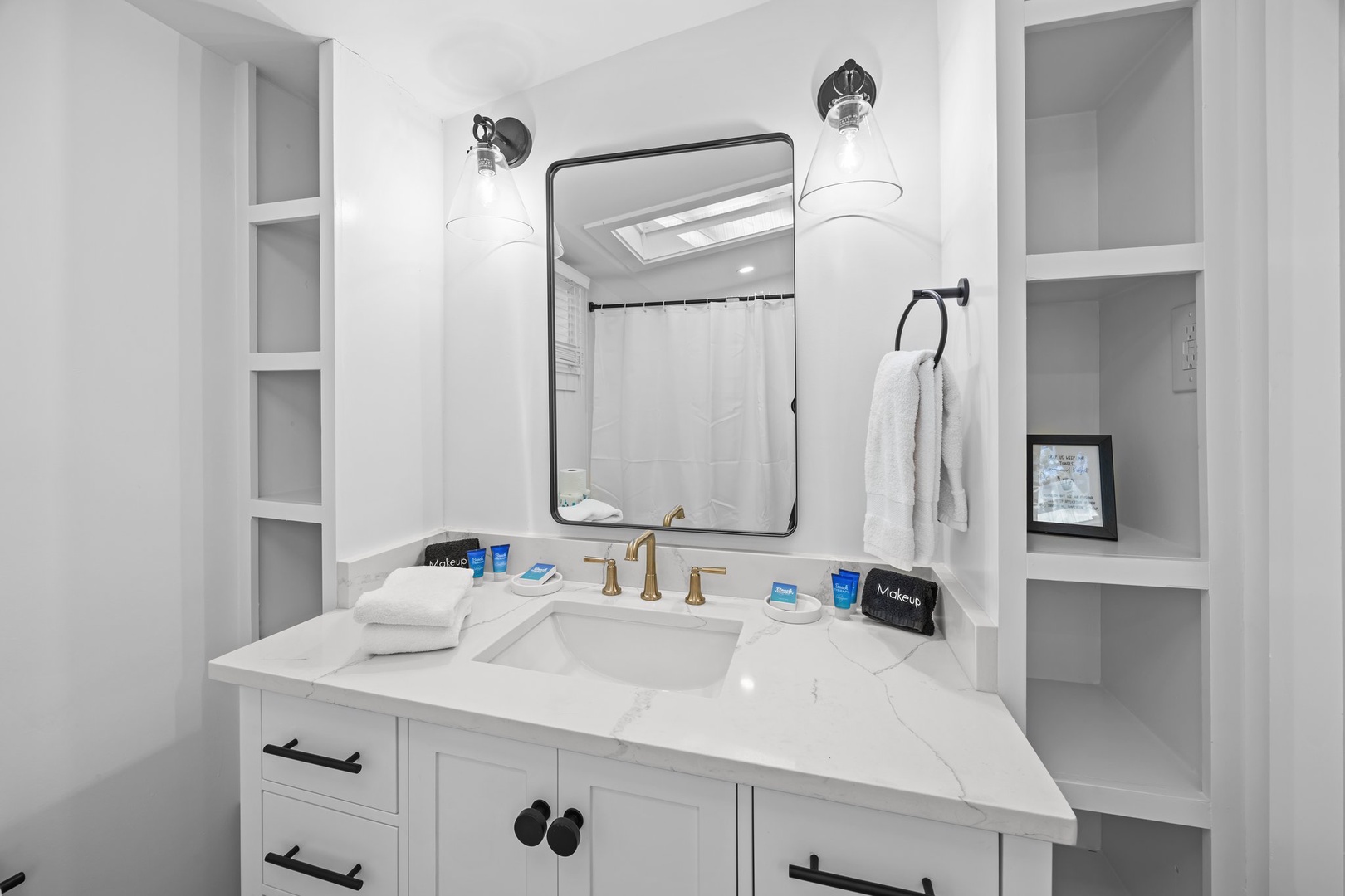 Your elegant marble bathroom vanity features thoughtful amenities and clever built-in storage for a truly luxurious morning routine.