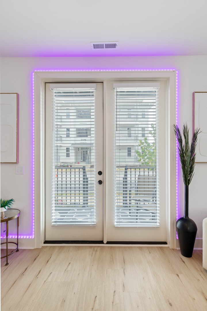 Set the mood with customizable color lighting in the living room.