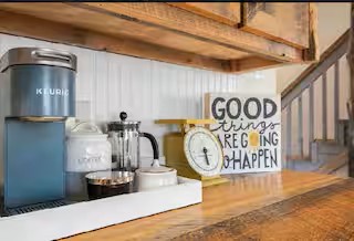 Start your mornings the right way with a dedicated coffee station, perfect for enjoying a fresh cup while taking in the peaceful surroundings of your cabin retreat.