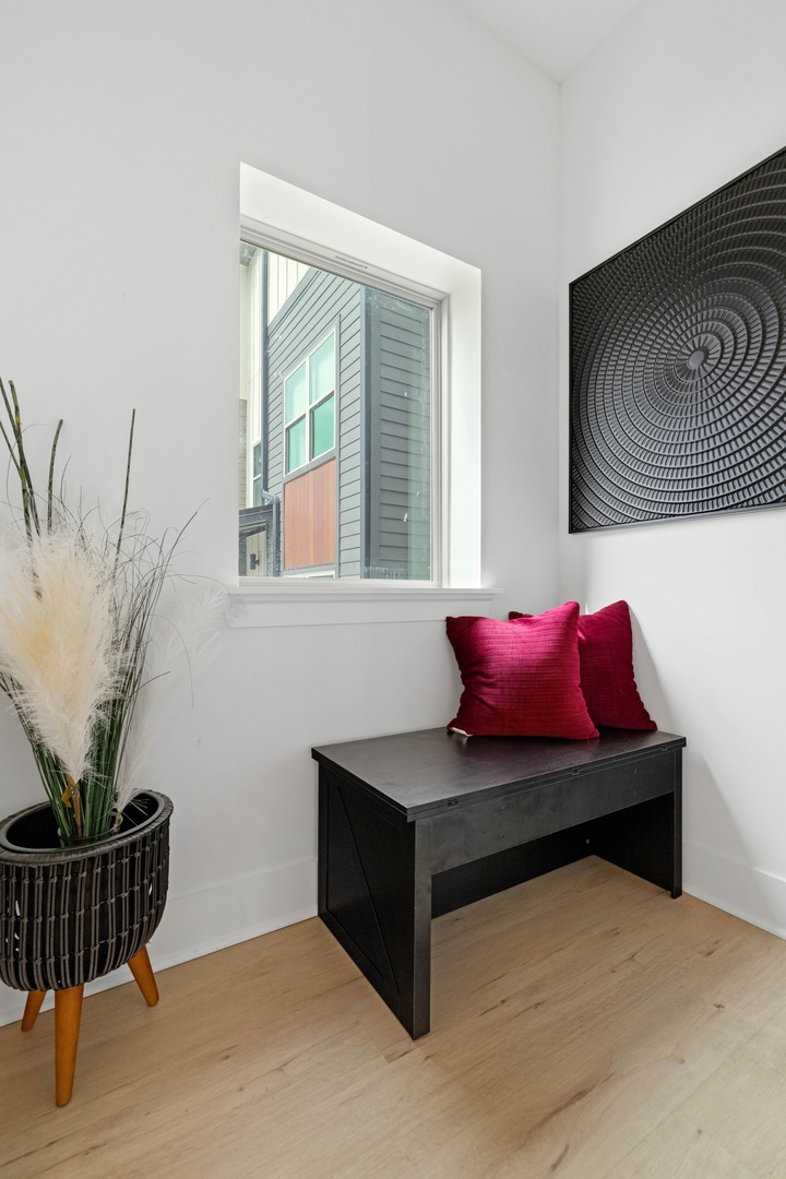 Discover a cozy little nook along the stairs, perfect for enjoying a quiet moment