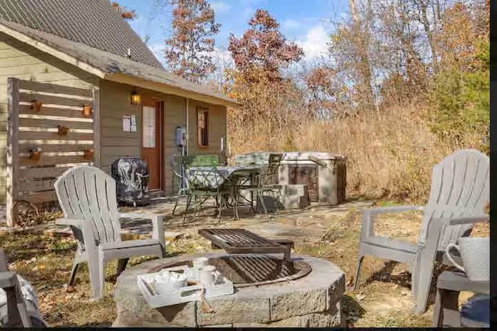 Escape into nature with a private outdoor space featuring a cozy fire pit and relaxing hot tub. Surrounded by peaceful wooded surroundings, it’s the perfect place to unwind, enjoy quiet evenings, and make lasting memories away from the everyday hustle.