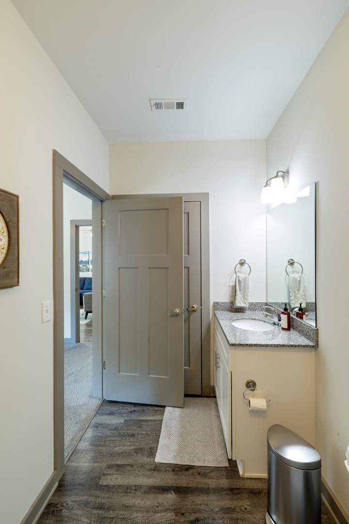 The spacious single sink vanity provides plenty of room to get ready, with convenient counter space and storage for your essentials.