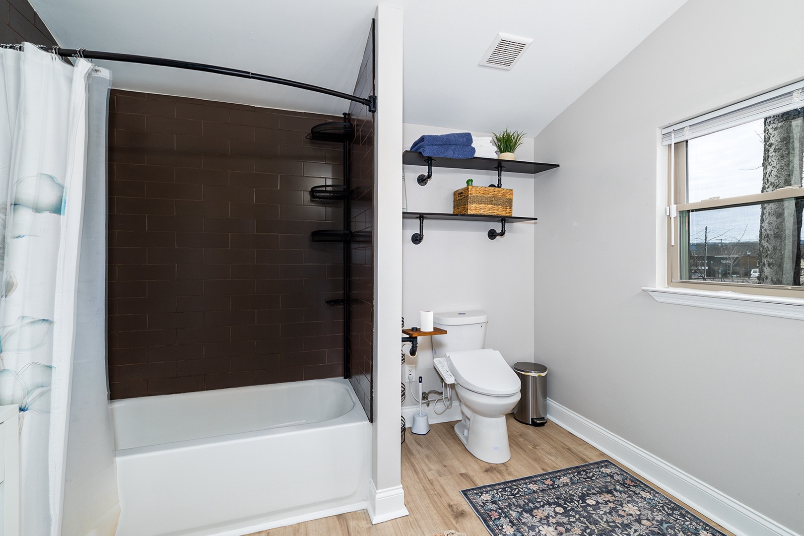 Private attached bathroom with bidet and tub/shower combo